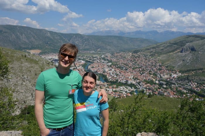 Mostar: Discovering the scars of the war that rocked Bosnia. The bombed out buildings that remain, Bosnia and Herzegovina, Bombed out buildings, sniper towner, exploring the sniper tower, how to get in, is it safe, mountains, cross, view from sniper tower, bullet holes, yugoslavia, balkan war, siege, fighting, croats, serbs, bosnians, muslims, front line, history