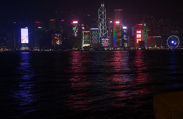 Buildings lit up at night at Victoria Harbour, Backpacking in Hong Kong for backpackers, Backpackers guide to Hong Kong, Hong Kong on a budget trip 