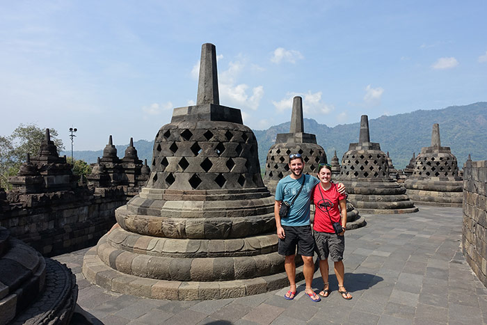 Nic and Shorty standing next to the massive stupas of Borobudur temple near Yogyakarta, Indonesia