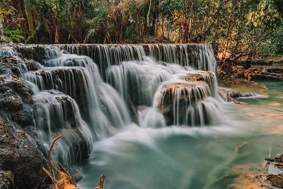 One of the multi levelled pools at Kuang Si waterfall in Luang Prabang, Laos taken with a slow shutter speed long exposure photography