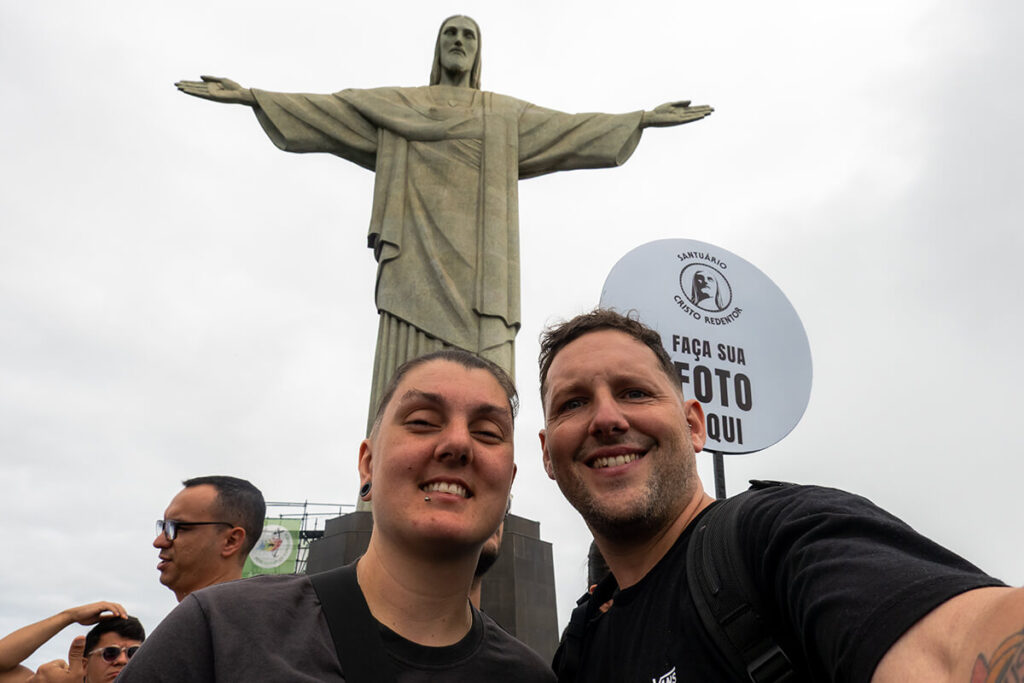 Nic and Shorty taking a selfie at Christ the Redeemer in Rio de Janeiro.