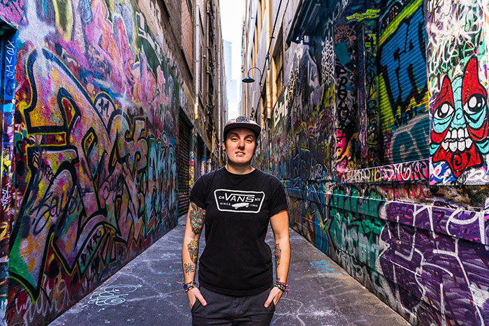 Nic standing on Union place in Melbourne, Victoria, Australia, a tight laneway with some of the best street art in the city